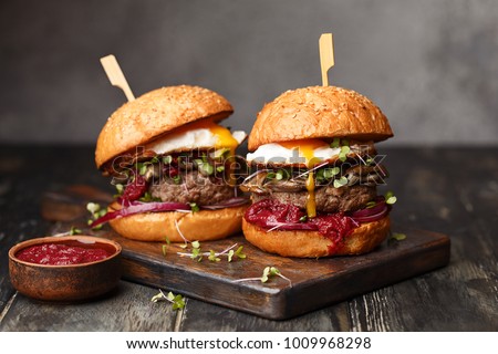 Similar – Image, Stock Photo homemade hamburgers on rustic wood