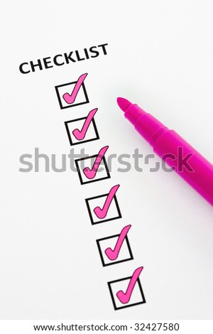 Checklist with checkboxes ticked using a pink pen