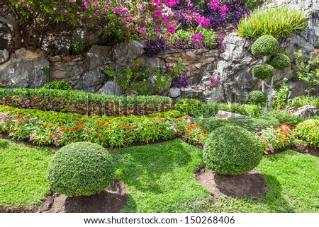 Colourful Flowerbeds and Winding Grass Pathway in an Attractive Thailand Formal Garden