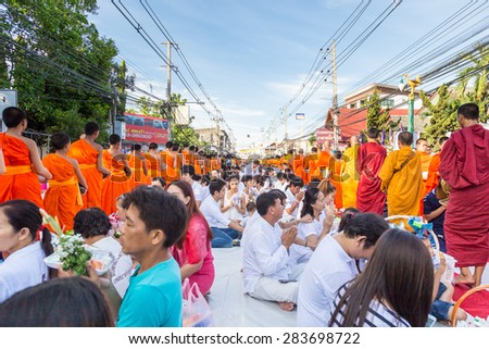 CHIANG MAI, THAILAND - May 31 : Many people give food and drink for alms to 1,536 Buddhist monks in visakha bucha day on May 31, 2015 in Chiang Mai, Thailand.