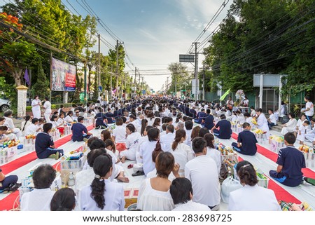 CHIANG MAI, THAILAND - May 31 : Many people give food and drink for alms to 1,536 Buddhist monks in visakha bucha day on May 31, 2015 in Chiang Mai, Thailand.