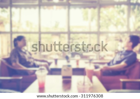 abstract blurred people in coffee shop with vintage tone.