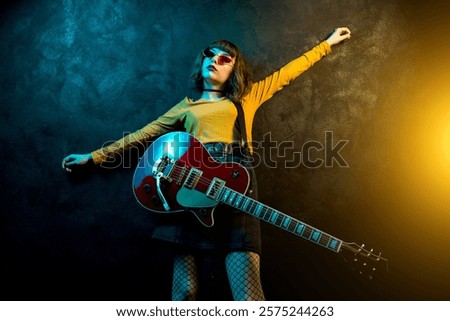 Similar – Image, Stock Photo Young hipster woman playing the guitar smiling outside the forest park of the city. Having fun learning a new skill, music play seasonal style. Young short hair girl. Copy space