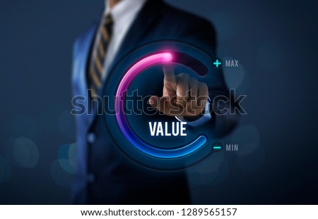 Growth value, increase value, value added or business growth concept. Businessman is pulling up circle progress bar with the word VALUE on dark tone background. Stock foto © 
