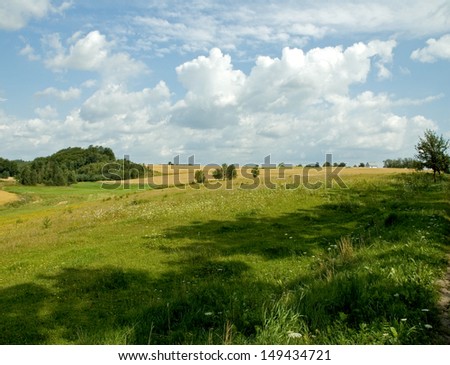 Country Landscape View with Meadows and Clouds, SUmmertime in Kaszuby, Northern Poland