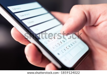 Online form to register personal info and data to web site with mobile phone. Person typing information to internet document, survey or questionnaire with smartphone. Customer registration to website. Imagine de stoc © 