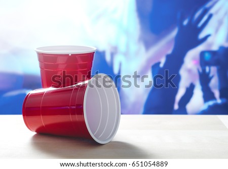 Similar – Image, Stock Photo two plastic cups with liquor stand on a wooden table