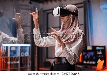 Similar – Image, Stock Photo Arab woman in VR headset on embankment