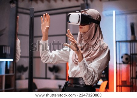 Similar – Image, Stock Photo Arab woman in VR headset on embankment