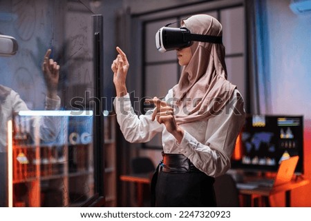 Similar – Image, Stock Photo Arab woman in VR headset on embankment