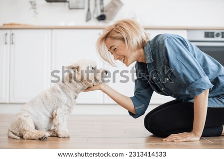 Similar – Image, Stock Photo Blond haired lady is posing in park dancing with her long blond hair fling in an air