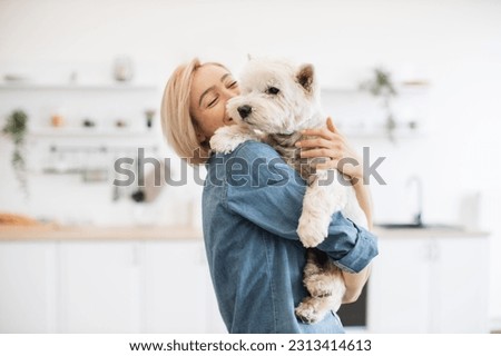 Similar – Foto Bild Frau hält Hund zu Hause