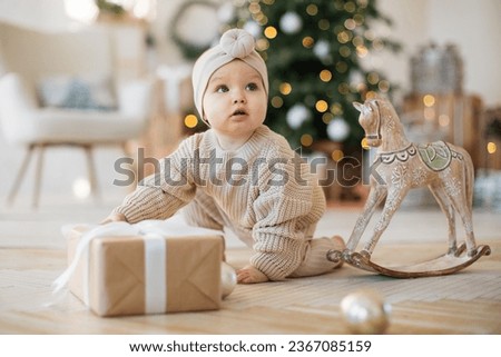 Similar – Image, Stock Photo A cute girl plays on her phone while her sister does her homework. Communication, social distance during quarantine. Distance learning, online education