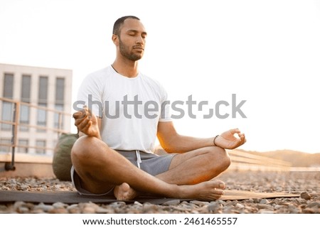 Similar – Image, Stock Photo Man doing yoga by the beach