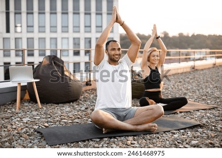 Similar – Image, Stock Photo Male making yoga exercise near window