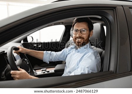 Similar – Image, Stock Photo Man driving from behind