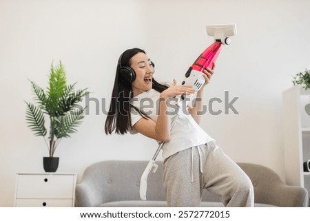 Similar – Image, Stock Photo Woman in her twenties with electric scooter recording voice note with a smartphone outdoors.