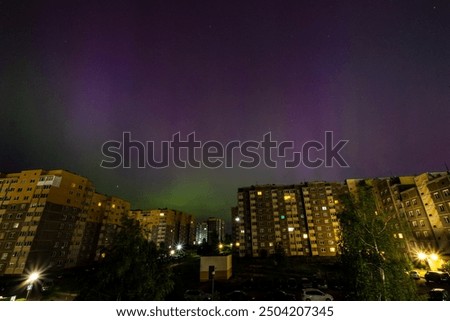 Similar – Image, Stock Photo Lights over the city. Two upward shining white stripes in the blue sky above the houses.