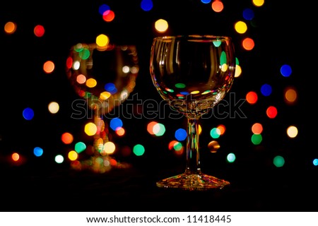 two wine glasses with colored flares