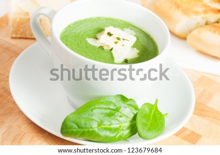 spinach soup with cream, parmesan cheese and crostini