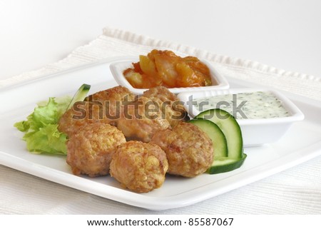 meatballs with vegetables and dill sauce and red pepper salsa