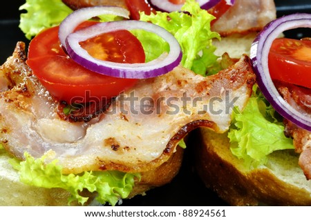 sandwiches plate with roasted  bacon, lettuce and  tomatoes