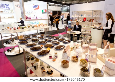 PARIS, FRANCE - JANUARY 24, 2014: The manager awaits visitors on a stand showing coffee beans at Maison&Objet, the French leading professional trade show for home fashion in Paris, France.