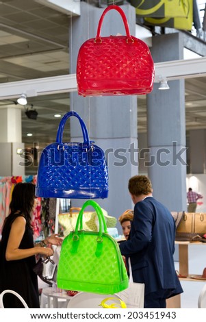 PARIS, FRANCE - JULY 5, 2014: People visit stands at Mode City, a swimwear and lingerie tradeshow where over 20,000 buyers meet 500 exhibitors from 35 different countries.