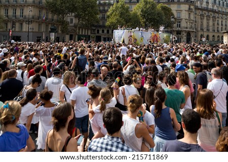 PARIS, FRANCE - SEPT. 7, 2014: A big crowd cheers and dances during the \