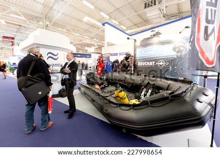 PARIS, FRANCE - OCTOBER 30, 2014: People visit stands at Euronaval, a major Defense and Marine Military exhibition in Le Bourget near Paris, France.