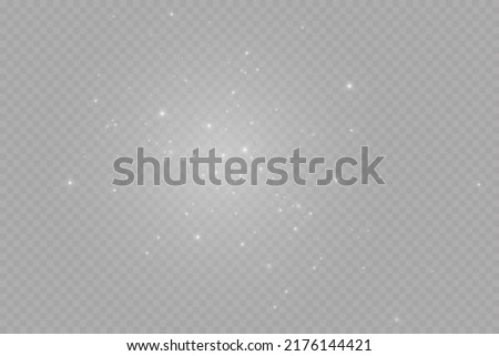 Dust sparks and stars shine with a special light. Christmas light effect. Glittering particles of magic dust.Vector sparkles on a transparent background.