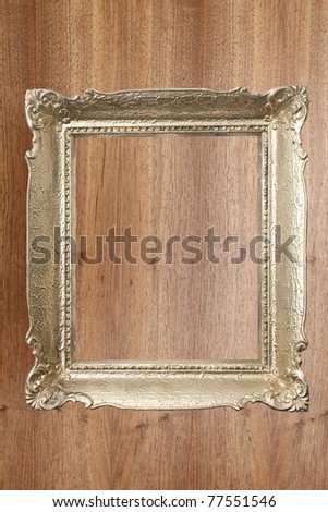 gold old frame on wooden background