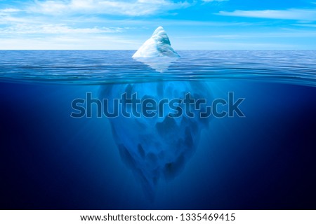 Tip of the iceberg. Underwater iceberg floating in ocean.