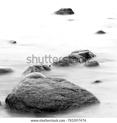 Monochrome black & white shore sea water and stones on the Orlowo beach in Gdynia, Tricity, Poland Photo stock © 