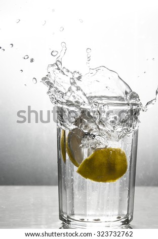 Lemons splashing in water