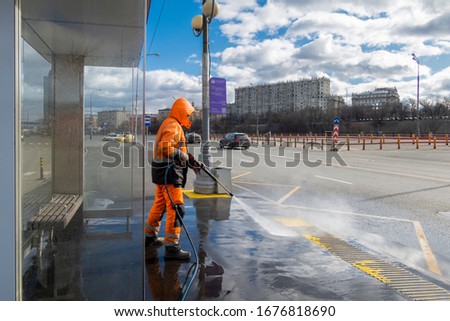 Image, Stock Photo Road worker cleaning city street with high pressure power washer, cleaning dirty public transport stops, Moscow, Russia