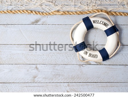 Welcome on Board - lifebuoy on wooden background and copy space for individual text