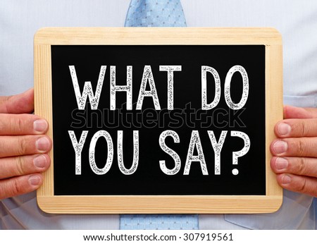 What do you say ? - Businessman with blackboard and text