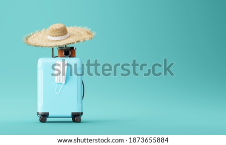 blue suitcase with face mask and travel accessories  on blue background. 3d rendering	
