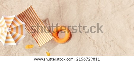 Beach umbrella with chairs, inflatable ring on beach sand. summer vacation concept. 3d rendering Photo stock © 