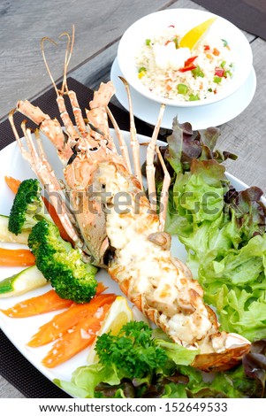 close up baked lobster with cheese serves with rice