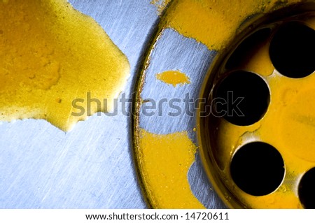 Macro of sink with yellow liquid substance