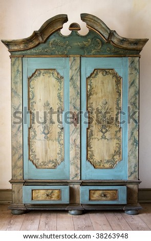 antique painted cupboard. old hand made furniture in wood with drawers and doors