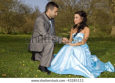 ethnic couple at engagement or wedding. young turkish people together in love with blue dress and suit