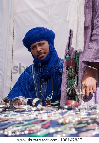 GRAZ,AUSTRIA-JULY 15:Unidentified man in the blue turban sells jewelery on Chiara Afrika Festival on July 15,2012 in Graz,Austria.