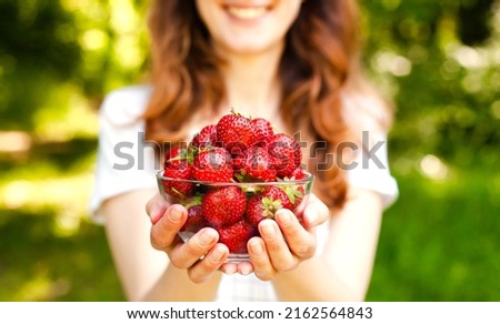 Similar – Image, Stock Photo Young woman eating strawberry dessert in cafe