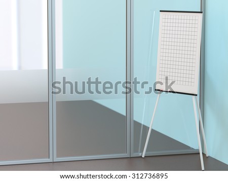Blank flipchart stands near the wall in conference room
