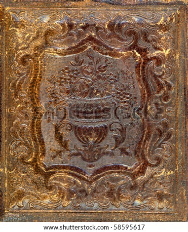 Macro Image of a well worn Gutta-Percha photo case from the 1850\'s. Used to house the earliest photographs, such as Daguerreotypes, Ambrotypes and Tintypes. In use 1840s-1870s (victorian era)