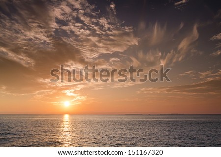 Beautiful Sunset over the ocean waters and Gulf of Mexico in Key West Florida shot during a Sunset Cruise.