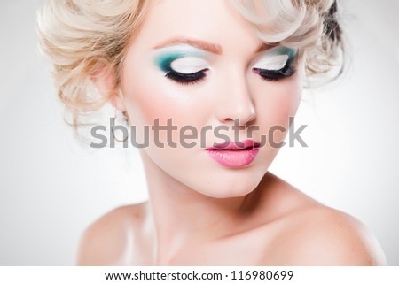 close-up of eye make-up on beautiful woman with doll face